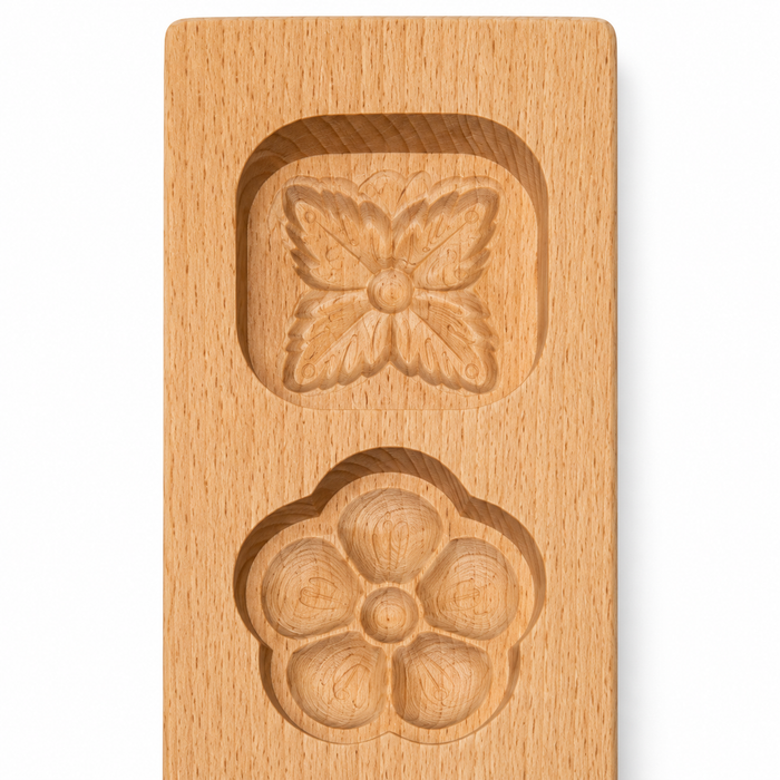 Mooncake Holzform mit vier dekorativen Motiven auf weißem Hintergrund